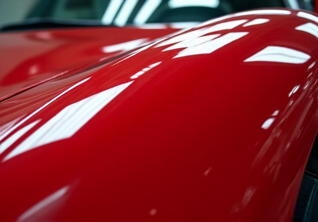 The sports car with a flawless, mirror-like finish after ceramic coating.